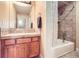 Cozy bathroom features warm neutral tones, a single vanity, and a tub/shower combo at 714 Skywalker Pt, Lafayette, CO 80026
