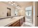 Bathroom with double sink vanity featuring plenty of space and adjacent bedroom views at 714 Skywalker Pt, Lafayette, CO 80026