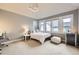 Cozy bedroom offers good natural light and neutral colored carpet at 714 Skywalker Pt, Lafayette, CO 80026