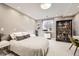 Basement bedroom featuring neutral tones, a round bed, and vintage decor at 714 Skywalker Pt, Lafayette, CO 80026