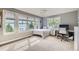 Bright bedroom features large windows and a comfortable space for relaxation at 714 Skywalker Pt, Lafayette, CO 80026