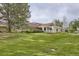 Beautiful clubhouse exterior surrounded by manicured lawns, ideal for community events and leisure at 714 Skywalker Pt, Lafayette, CO 80026