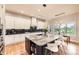 A gourmet kitchen with granite countertops, stainless steel appliances, and a large kitchen island at 714 Skywalker Pt, Lafayette, CO 80026