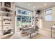 Cozy living room with large windows, a comfortable couch and decor at 714 Skywalker Pt, Lafayette, CO 80026