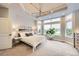 Spacious main bedroom with large windows, tray ceiling, and bright neutral colors at 714 Skywalker Pt, Lafayette, CO 80026
