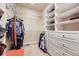 Walk-in closet with custom shelving and drawers to organize your wardrobe at 714 Skywalker Pt, Lafayette, CO 80026