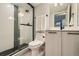 Modern bathroom featuring a sleek glass shower, contemporary vanity, and stylish fixtures for a spa-like experience at 2475 E 28Th Ave, Denver, CO 80205