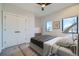 Bedroom features plush carpet, ceiling fan, and ample natural light at 2475 E 28Th Ave, Denver, CO 80205