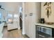 Sitting area featuring an adjacent beverage cooler, coffee maker, and stairway at 2475 E 28Th Ave, Denver, CO 80205