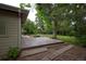 Outdoor back deck overlooking mature backyard trees and landscaping at 7140 S Uinta St, Centennial, CO 80112