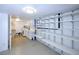 Utility area featuring washer/dryer hookups and wall shelving at 7140 S Uinta St, Centennial, CO 80112