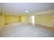Spacious finished basement featuring carpet and tile flooring, as well as recessed lighting at 7140 S Uinta St, Centennial, CO 80112
