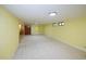 Spacious finished basement featuring neutral paint, carpet, and recessed lighting at 7140 S Uinta St, Centennial, CO 80112