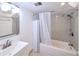 Bathroom featuring neutral paint, mirror, vanity, shower and tub combination at 7140 S Uinta St, Centennial, CO 80112