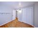Bedroom with hardwood floors, sliding closet doors and access to ensuite bathroom at 7140 S Uinta St, Centennial, CO 80112