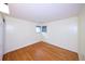 Bedroom with hardwood floors, neutral paint, and bright light from large windows at 7140 S Uinta St, Centennial, CO 80112