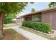 Well-maintained brick home with a charming walkway and mature landscaping at 7140 S Uinta St, Centennial, CO 80112