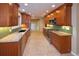 Well-equipped kitchen with wooden cabinets, updated countertops, and stainless steel appliances at 7140 S Uinta St, Centennial, CO 80112