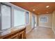 Bright sitting room features large windows, sliding glass door, and custom woodworking at 7140 S Uinta St, Centennial, CO 80112