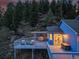 Entertain with ease on the home's deck featuring ample seating and a BBQ at 33633 Elk Run, Evergreen, CO 80439