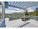 Beautiful deck with pergola, lounge seating, mountain views, and blue house exterior at 33633 Elk Run, Evergreen, CO 80439