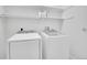 Laundry room featuring a side-by-side washer and dryer, as well as shelving at 33633 Elk Run, Evergreen, CO 80439