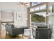 Living room with large windows that showcase the beauty of the trees outside at 33633 Elk Run, Evergreen, CO 80439
