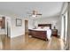 Spacious main bedroom with ceiling fan, hardwood floors and ensuite bathroom at 33633 Elk Run, Evergreen, CO 80439
