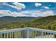 Enjoy the mountain views from the deck of this mountain home at 33633 Elk Run, Evergreen, CO 80439