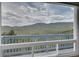 Scenic mountain view from interior window framing trees and a valley below at 33633 Elk Run, Evergreen, CO 80439