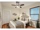 Cozy bedroom with a ceiling fan and ample natural light at 2421 Hooker St, Denver, CO 80211