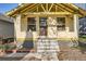 Close up of the front of the house showing the porch and front door at 2421 Hooker St, Denver, CO 80211