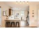 Bright kitchen featuring a breakfast bar with seating and stainless steel appliances at 2421 Hooker St, Denver, CO 80211