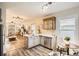Open floor plan featuring a kitchen with breakfast bar that flows into the living room at 2421 Hooker St, Denver, CO 80211