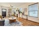 Bright living room featuring hardwood floors, a fireplace, and stylish decor at 2421 Hooker St, Denver, CO 80211