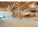 Unfinished basement with exposed ceiling beams, ductwork, and a framed wall, ready for customization at 8052 Mount Kataka St, Littleton, CO 80125