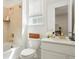 Bright bathroom featuring a shower-tub, white vanity with a marble countertop, and a modern faucet at 8052 Mount Kataka St, Littleton, CO 80125