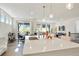 Open kitchen flows into the living area, featuring ample counter space and stainless steel appliances for modern living at 8052 Mount Kataka St, Littleton, CO 80125