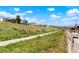 Scenic view of community landscape, featuring a walking path and neighborhood homes at 8052 Mount Kataka St, Littleton, CO 80125