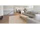 Open-concept living room seamlessly connected to a modern kitchen, perfect for entertaining guests and Gathering at 8052 Mount Kataka St, Littleton, CO 80125