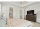 Bright and airy main bedroom with large windows, a tray ceiling, and modern furnishings at 8052 Mount Kataka St, Littleton, CO 80125