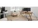 Bright home office with a comfortable chair, multiple monitors, and a neutral color scheme at 8052 Mount Kataka St, Littleton, CO 80125