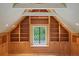 Charming attic with custom built-in wooden bookshelves and cabinets, perfect for storage and display at 5530 E 6Th Avenue Pkwy, Denver, CO 80220