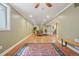 Finished basement featuring hardwood floors, area rugs, and ample lighting for a comfortable living space at 5530 E 6Th Avenue Pkwy, Denver, CO 80220