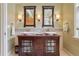Elegant bathroom features a double vanity with vessel sinks and decorative mirrors at 5530 E 6Th Avenue Pkwy, Denver, CO 80220