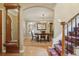 Inviting dining room featuring hardwood floors, a wooden table, and elegant chandelier at 5530 E 6Th Avenue Pkwy, Denver, CO 80220