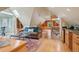 Open concept living room features a cozy seating area and a wet bar at 5530 E 6Th Avenue Pkwy, Denver, CO 80220