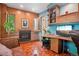 A cozy office space is equipped with a brick fireplace and built in shelving at 5530 E 6Th Avenue Pkwy, Denver, CO 80220