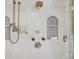 The gorgeous shower features dual shower heads and built in niches for storage at 5530 E 6Th Avenue Pkwy, Denver, CO 80220