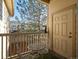 Cozy balcony with seating, offering a relaxing outdoor space and pleasant views of the neighborhood at 5726 N Genoa Way # 201, Aurora, CO 80019